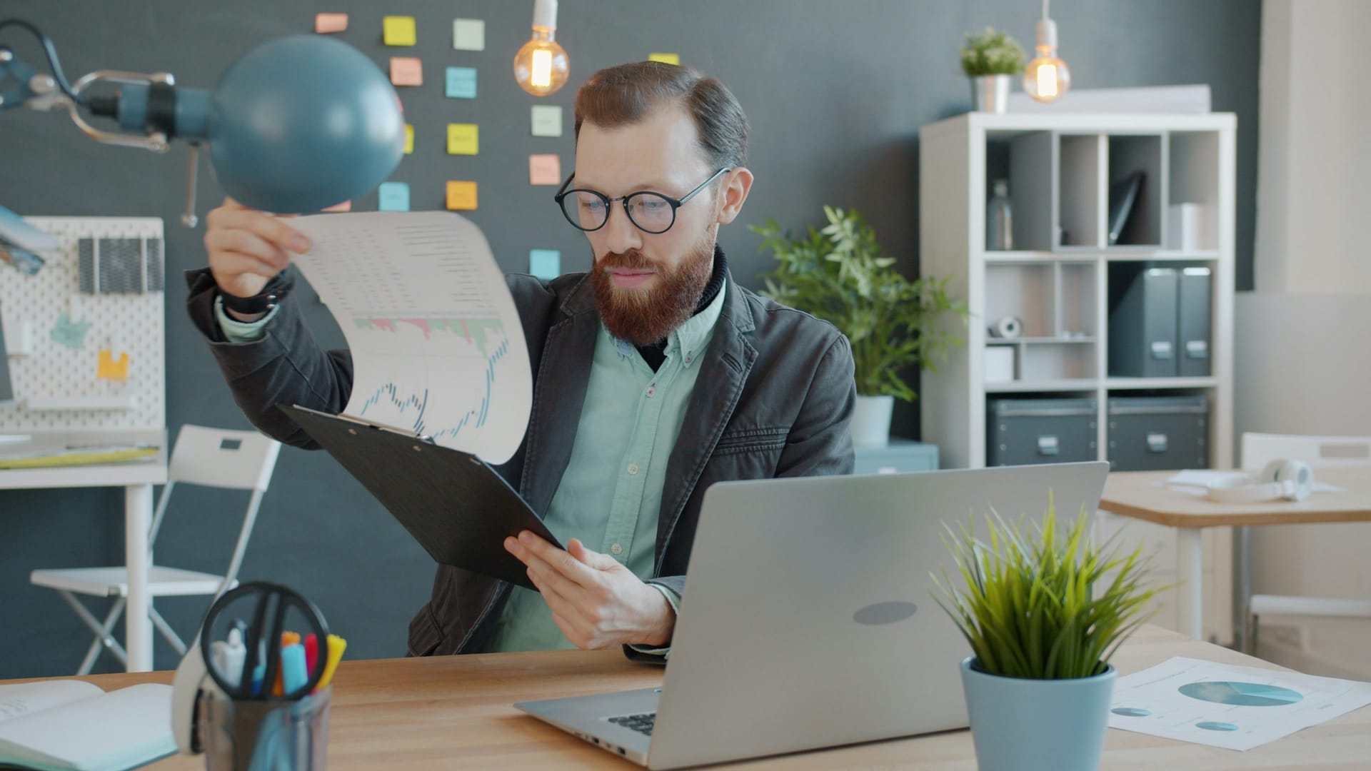 Brisbane business owner reviewing performance reports comparing single-channel and full-service digital marketing options